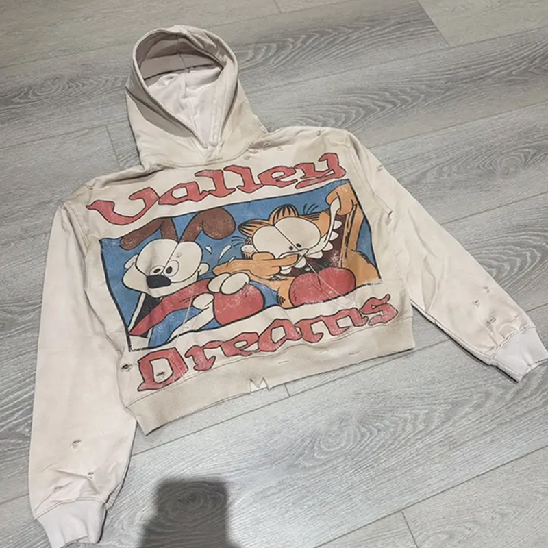 our pullover hoodie men features hole breaking treatment for a fashionable streetwear look.